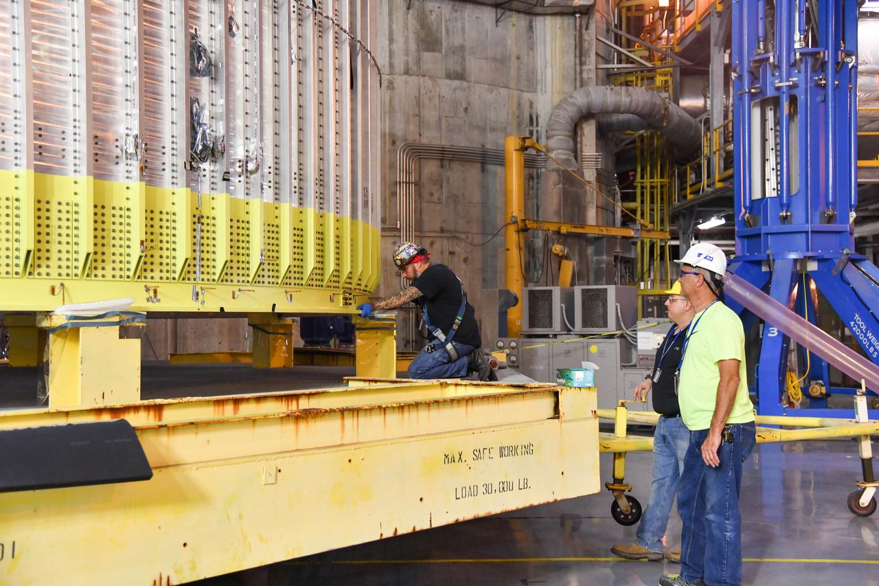 The Space Launch System (SLS) rocket’s liquid oxygen tank structural test article was manufactured and stacked in June 2019 at NASA’s Michoud Assembly Facility in New Orleans. To construct the test article, Boeing technicians at Michoud moved the liquid oxygen tank to the Vertical Assemby Building stacking and integration area. Here, they added simulators to mimic the two structures that connect to the tank, the intertank and the forward skirt.  This structural hardware for the SLS core stage for America’s new deep space rocket is structurally identical to the flight version of the tank. It will be shipped on the Pegasus barge to NASA’s Marshall Space Flight Center in Hunstville, Alabama, where it will undergo a series of tests that simulate the stresses and loads of liftoff and flight. These tests will help ensure designs are adequate for successful SLS missions to the Moon and beyond. The flight liquid oxygen tank along with the liquid hydrogen tank supplies more than 500,000 gallons of propellant to the core stages four RS-25 engines, which produce 2 million pounds of thrust to help send the SLS rocket to space.